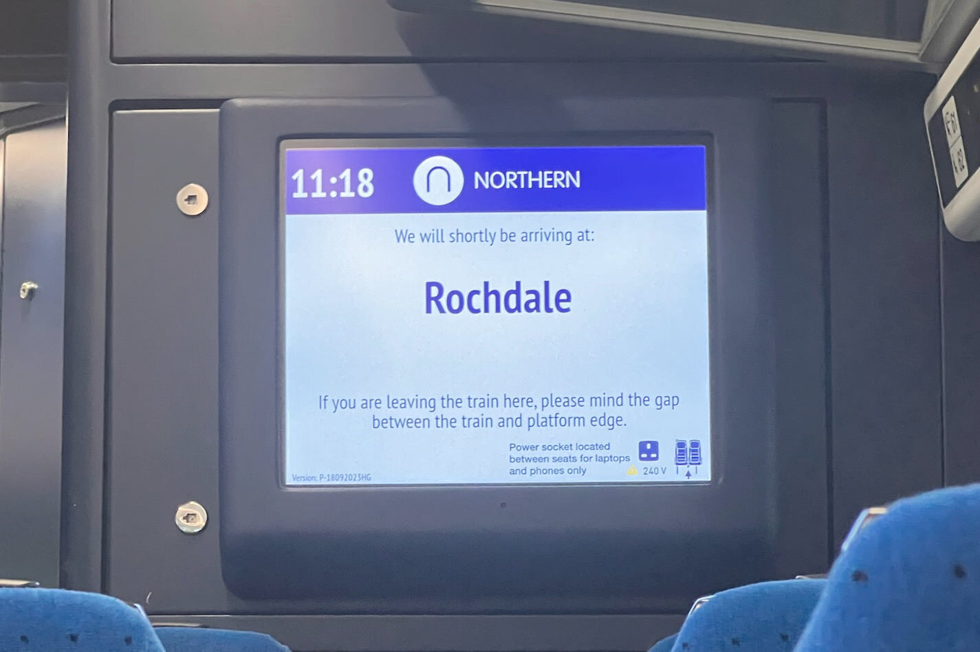 An in-train display announcing that the next station is “Rochdale”